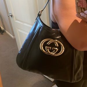 Limited edition Gucci handbag with gold Gucci logo.